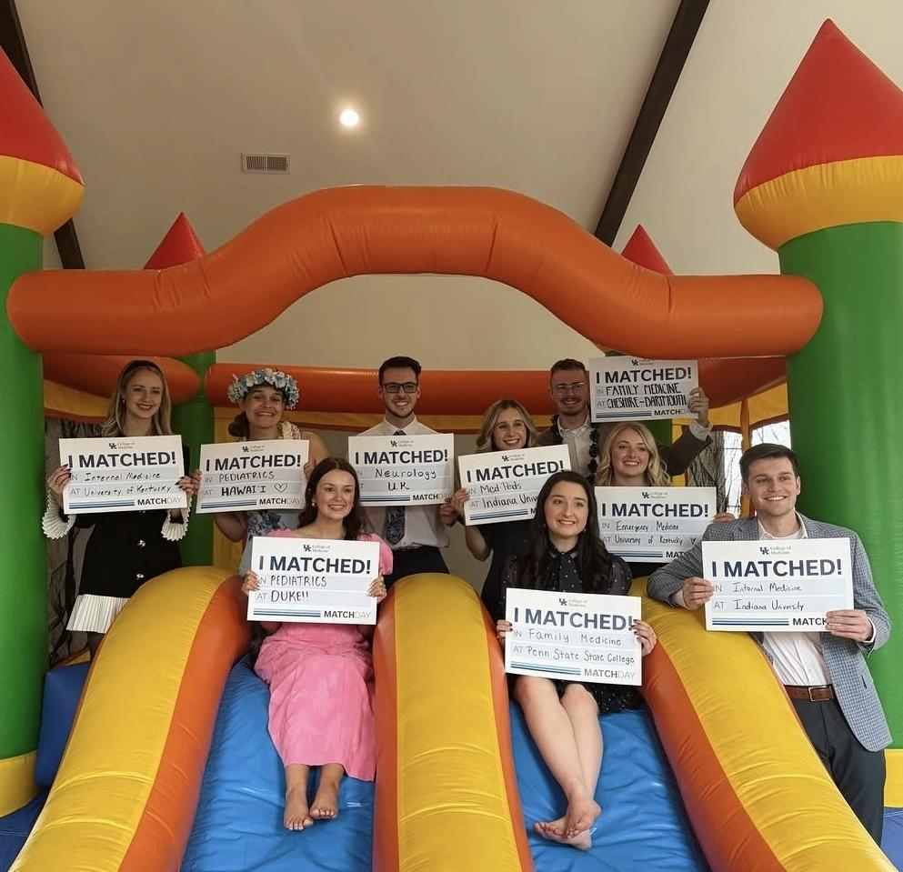 RPLP students celebrated Match Day with a bouncy house. Several students are pictured here holding signs reading "I MATCHED!" with details of their medical residency matches.