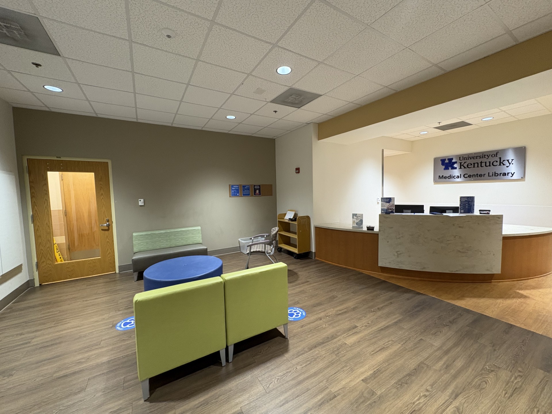 Photo of Medical Center Library entryway, with noted donation bin location