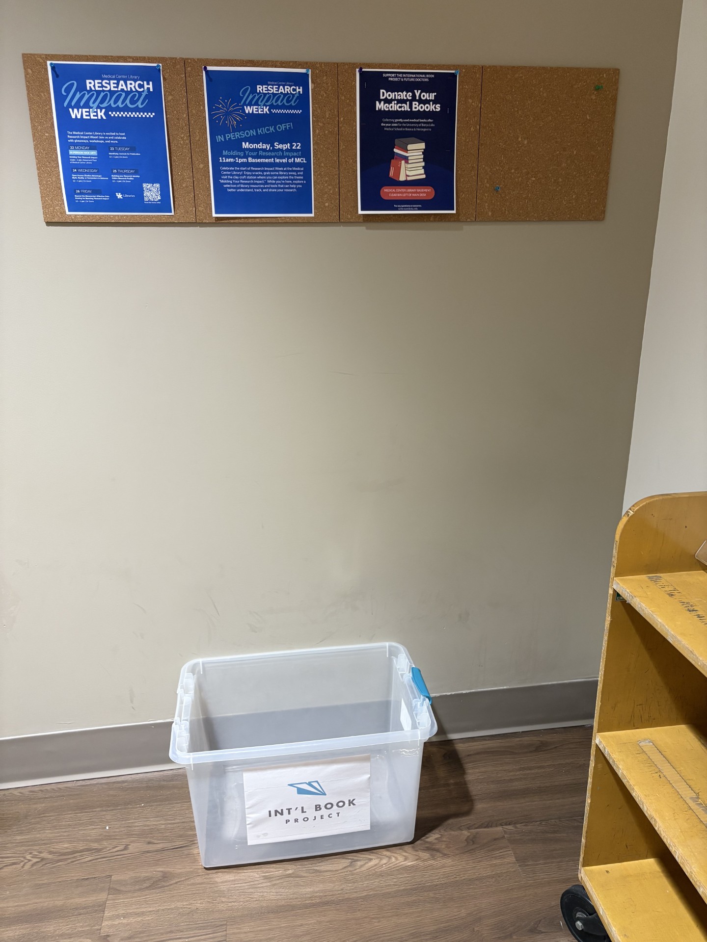 Textbook donation bin under sign