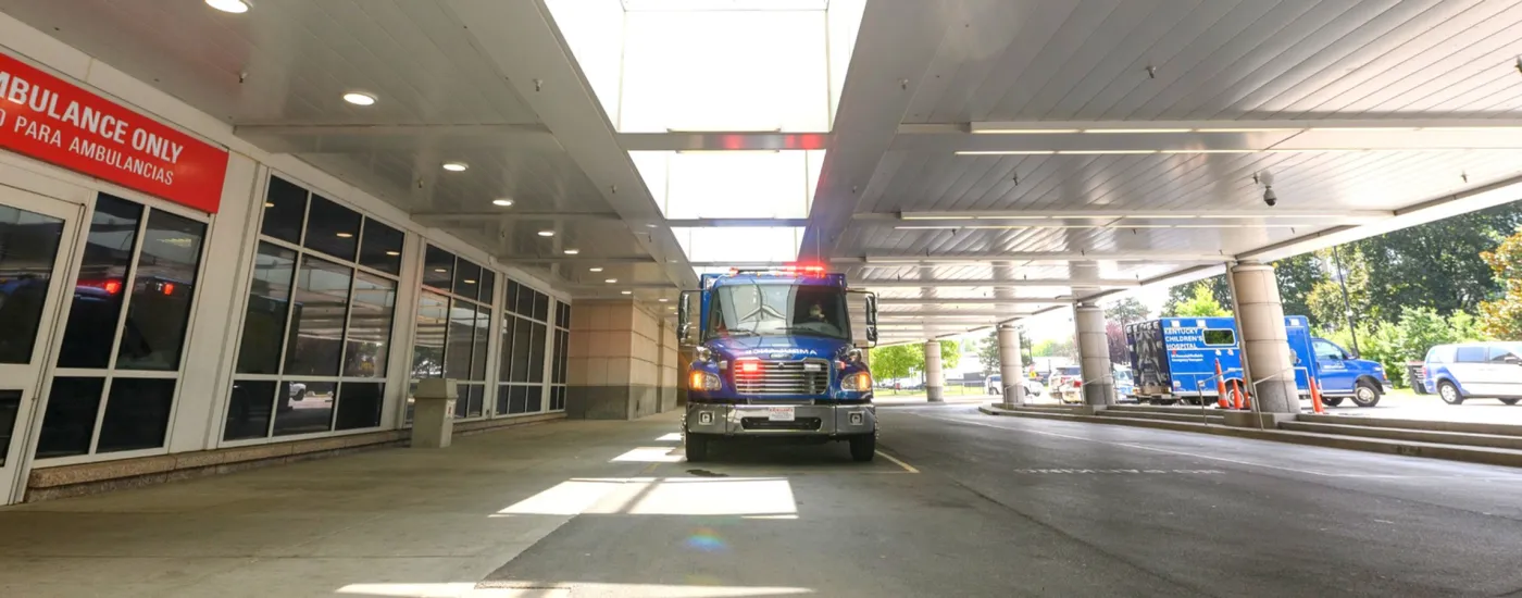 UK Emergency Medicine Department.  Learn more about EM Residency and other programs. Image depicts Emergency vehicle in front of hospital.