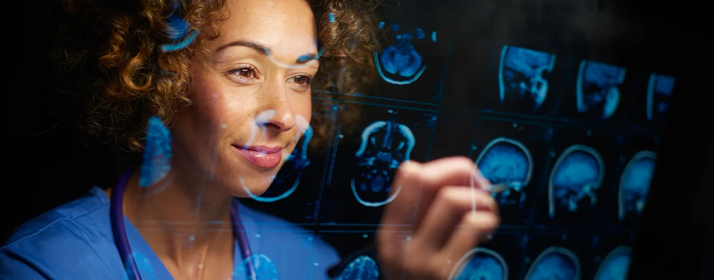 Person reviewing imaging pictures of a brain