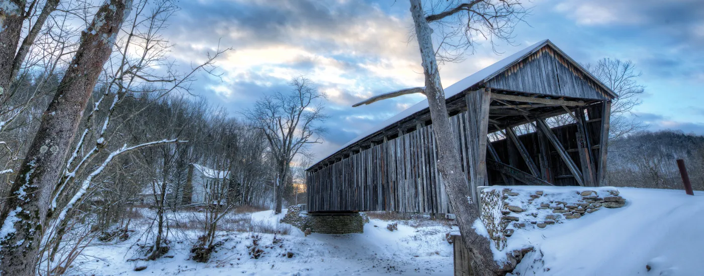 Photo of covered bridge in the snow