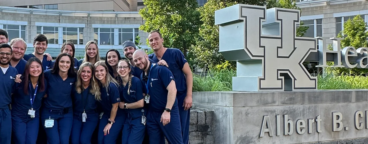 ENT Residency Team, standing next to the UK Albert B. Chandler hospital sign.