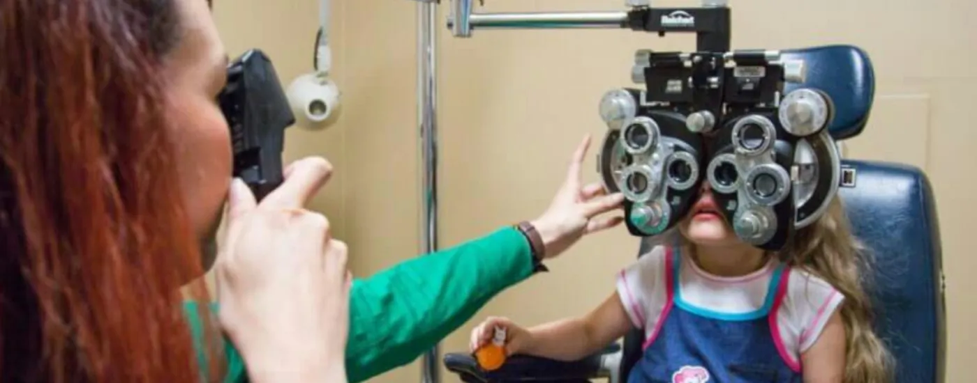 An eye exam is given to a young patient