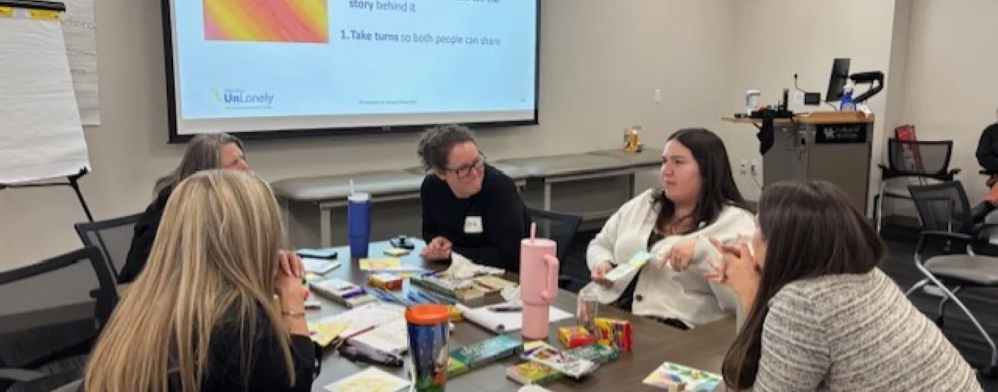 Group of people talking and sharing a story using colorful images