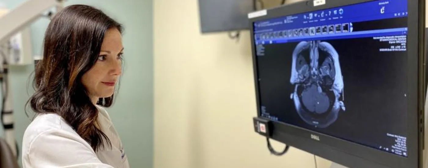A picture of Dr. McNulty looking at a scan