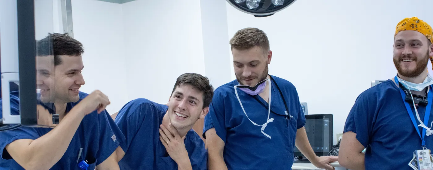 A group pic of 4 otolaryngology residents laughing