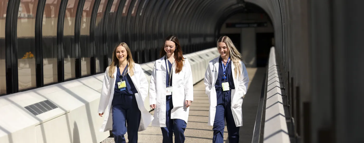 Physicians walking down a hallway