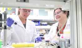 Jessica Blackburn (right) in her lab with staff scientist Yelena Chernyavskaya. (left)