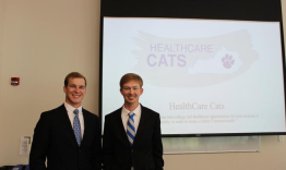 Jackson Miller (left) and Ethan Morgan (right) standing in front of their presentation.
