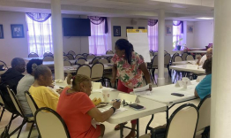 Yolanda Jackson (standing in the center) meets with focus group participants at First Baptist Church in Frankfort, Ky.