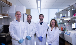 Ebbert and his team of three researchers standing in their lab.