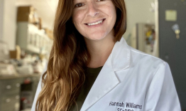 Image of Hnnah Downing in a white labcoat