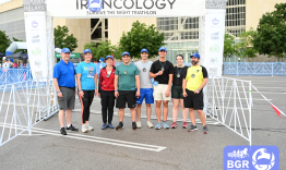 Physiology team stands at finish line. 