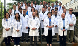 Faculty and residents in their white coats