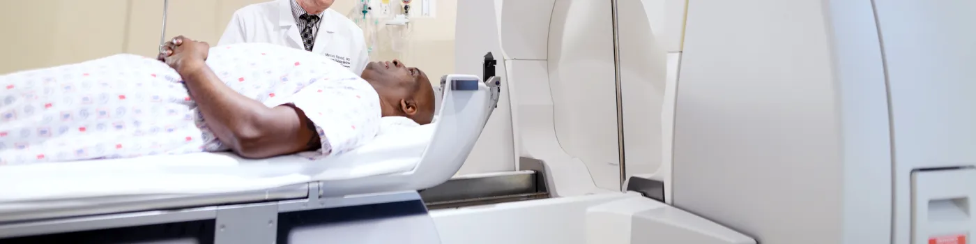 Chair Randall with a patient at an MRI