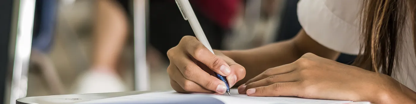 Female Student taking an exam.