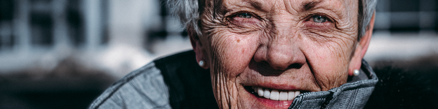 Elderly woman smiling.