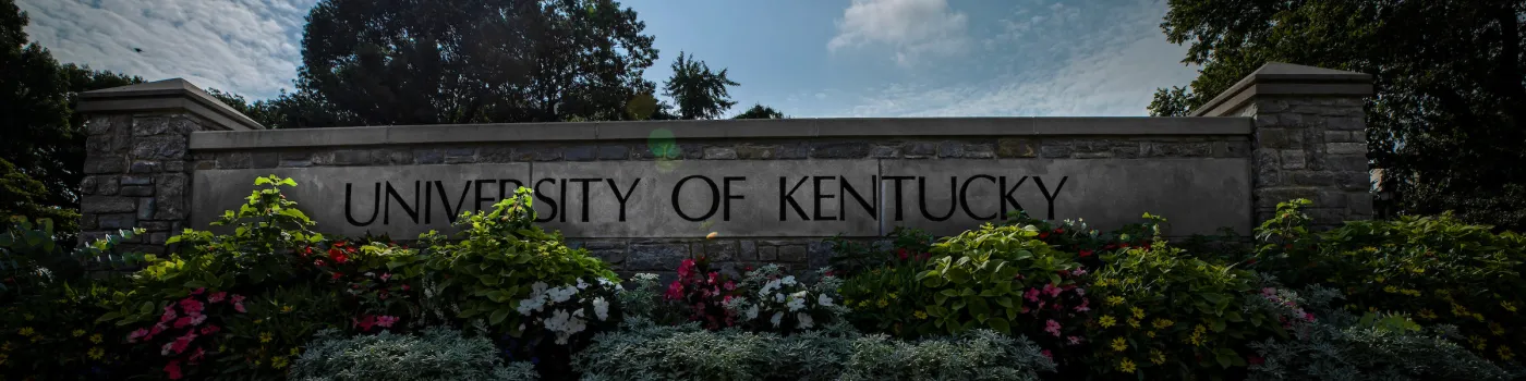 University of Kentucky sign with flowers around it