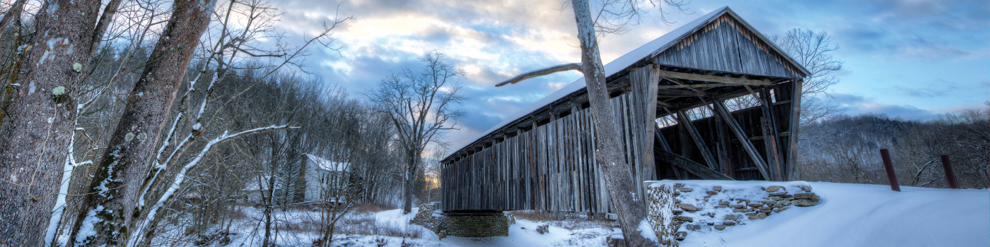 Photo of covered bridge in the snow