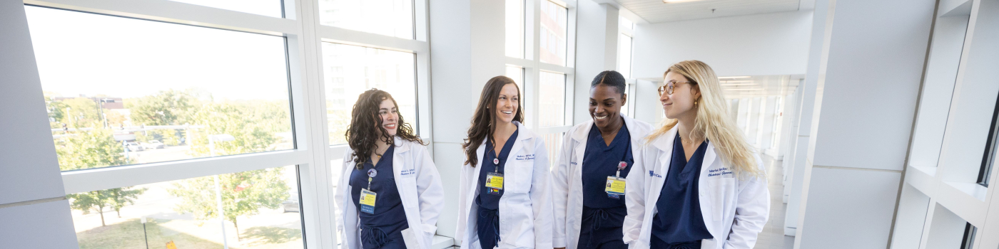 UK HealthCare OBGYN residents walking in hallway 