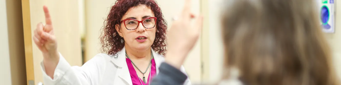 Sanders-Brown Center on Aging's Dr. Pinar Coskun provides medical examination.