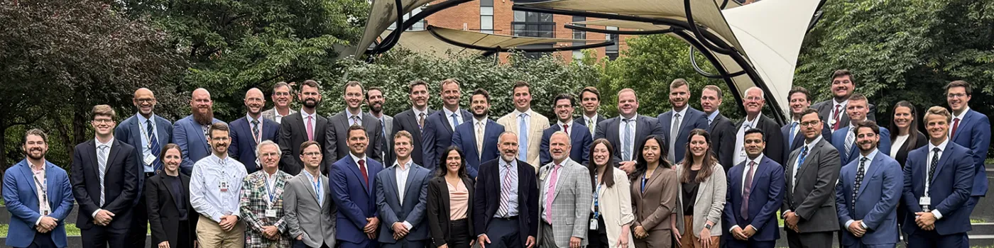 Orthopaedic surgery members gathered outside on the green of UKs campus.
