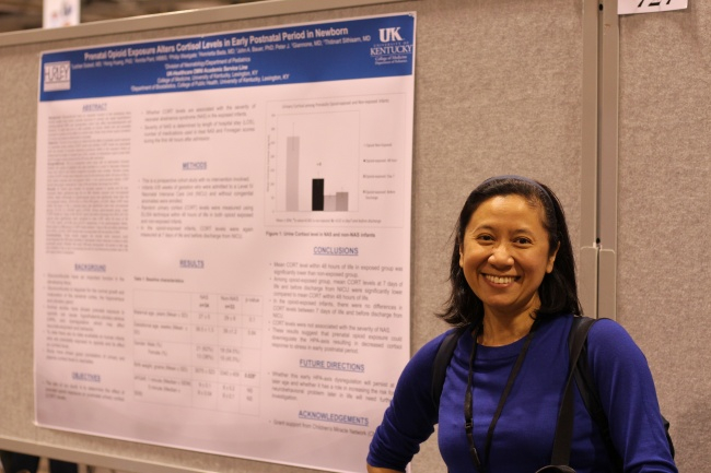 Dr. Thitnart Sithisarn standing next to the poster of a project she co-authored with a former fellow at the 2018 Pediatric Academic Socients (PAS) Conference in Toronto.