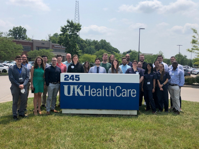 Psychiatry residents from 2021 in front of UK HealthCare sign