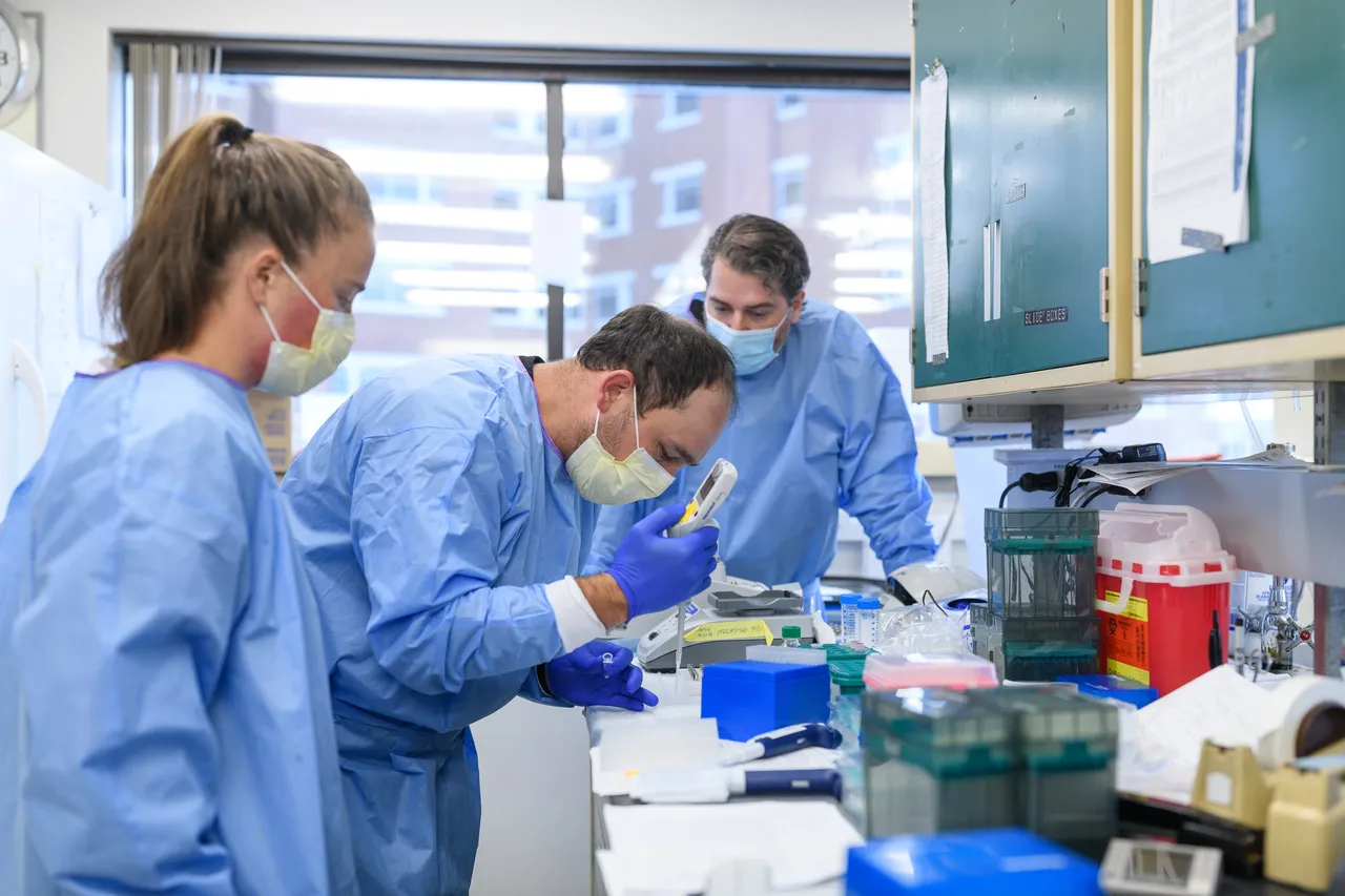 3 technicians or researchers completing laboratory testing