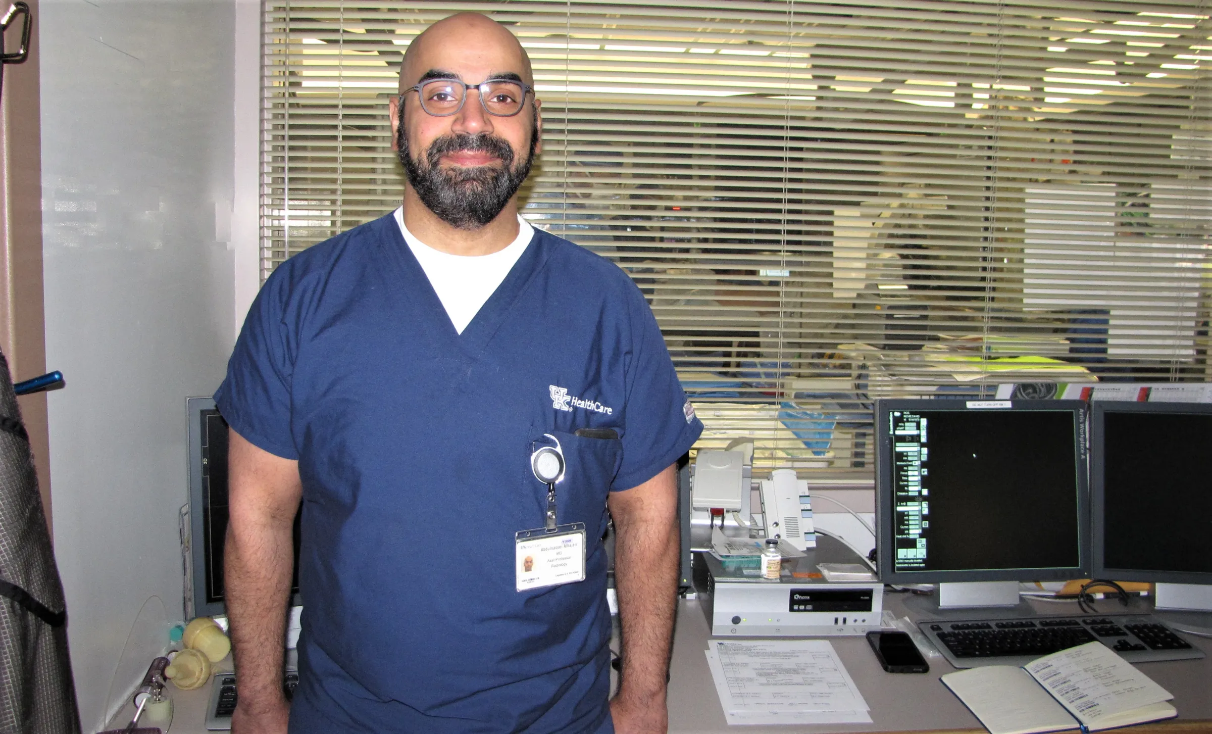 Dr. Abdulnasser Alhajeri standing in front of a desk