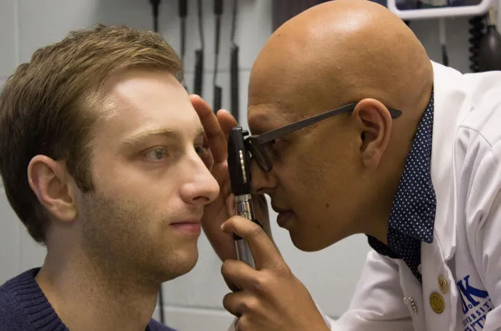 Doctor conducting an eye exam.