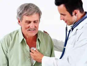 doctor listening to patient's heart through stethoscope