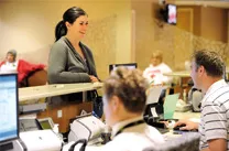 Woman at KNI desk