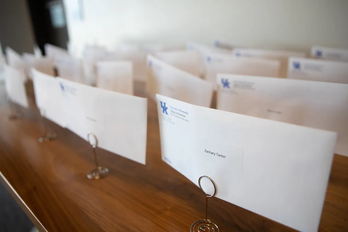 lots of UK College of Medicine envelopes on a table