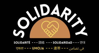 image with 'Solidarity' curved in a semi-circle with two hands shaking creating a heart shape underneath. The word "solidarity" is written out in several different languages.
