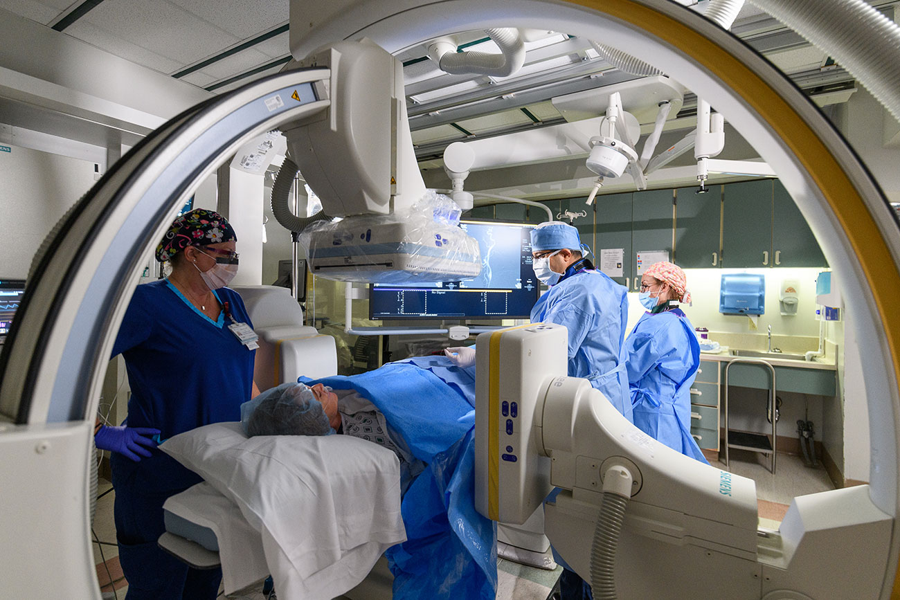 doctors and nurse in an interventional radiology diagnostic room