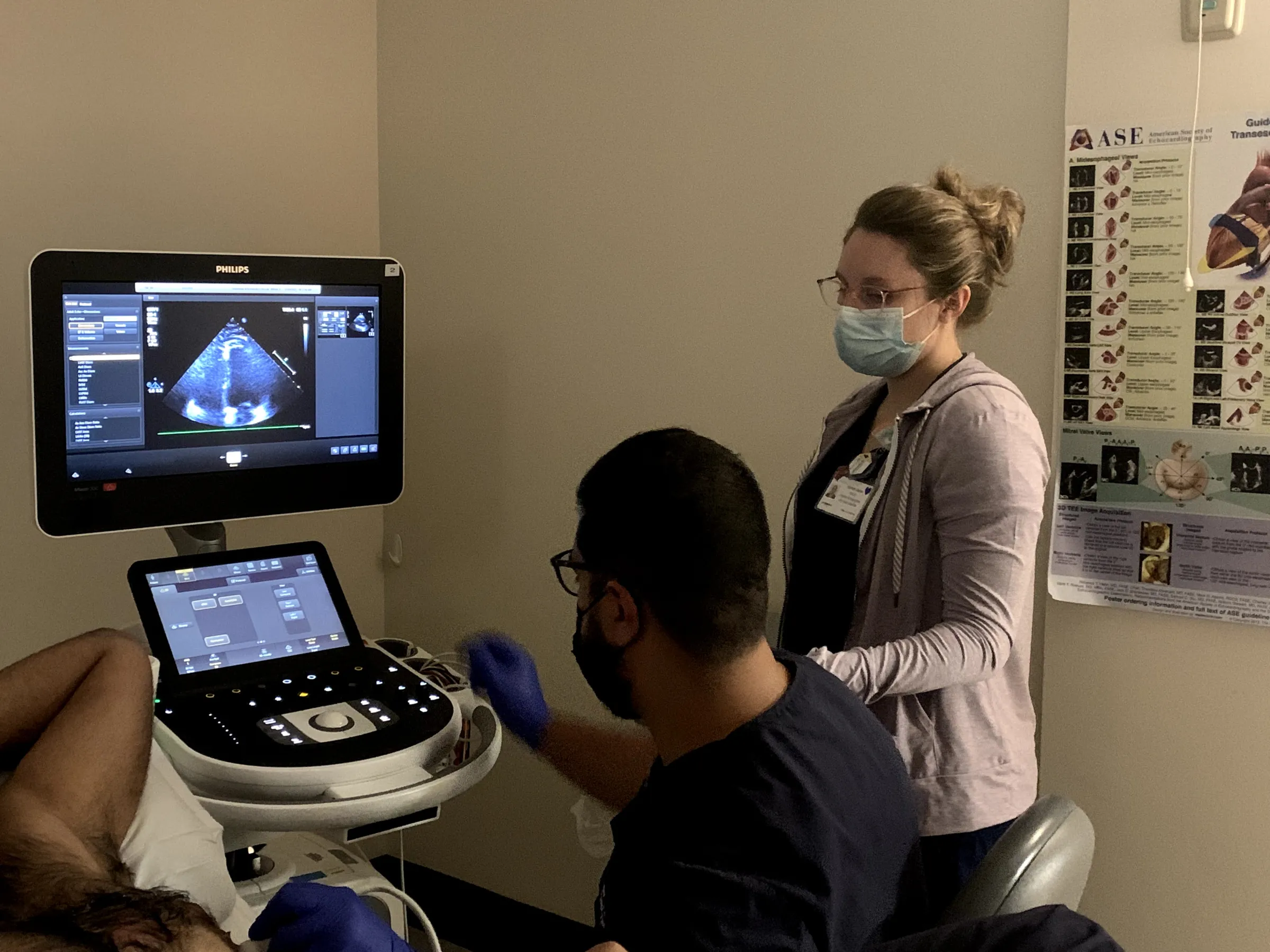 bedside scan of patient's heart; heart image on screen