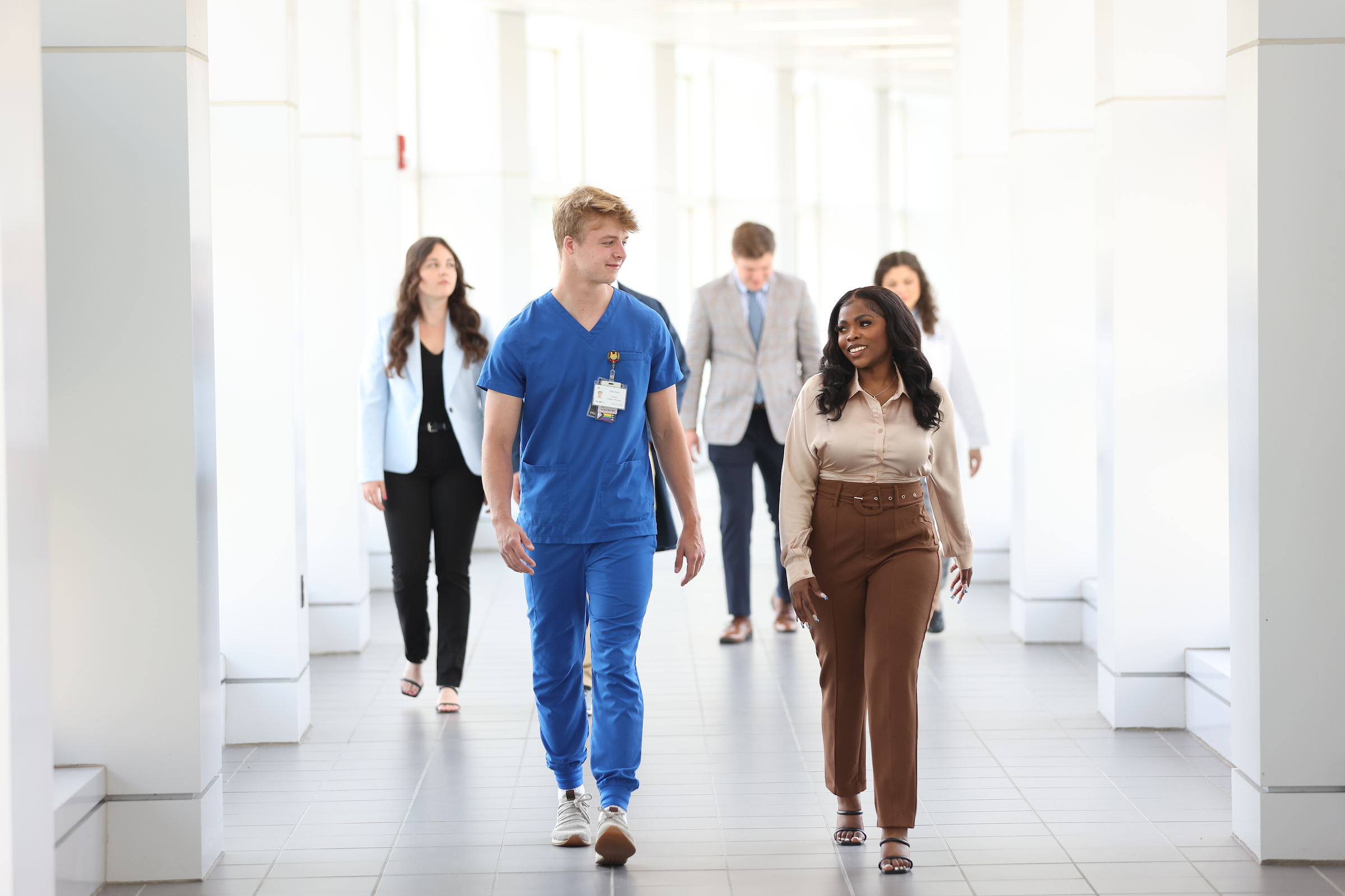 students walking through medical building