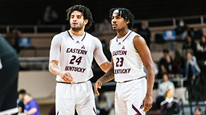 two EKU basketball players standing next to each other during a game