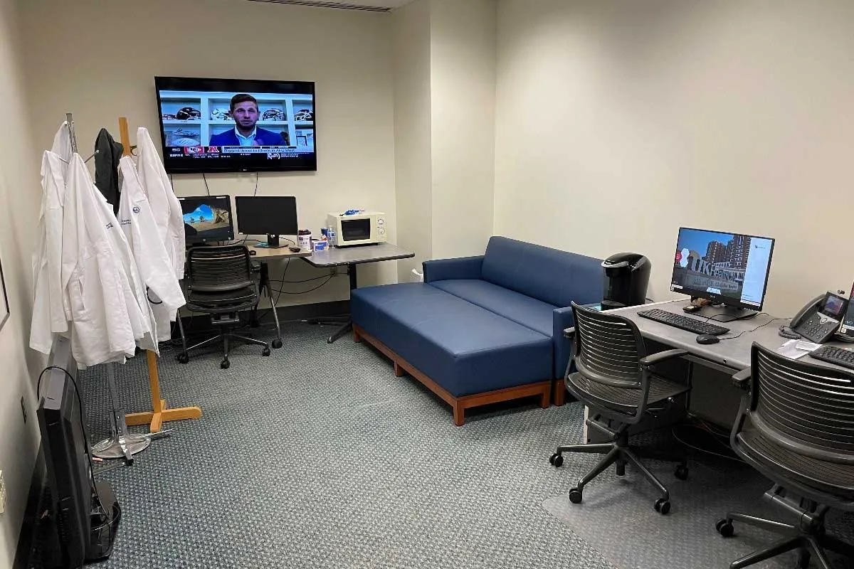 cardiovascular fellows room; desk, coach, chairs, tv, microwave