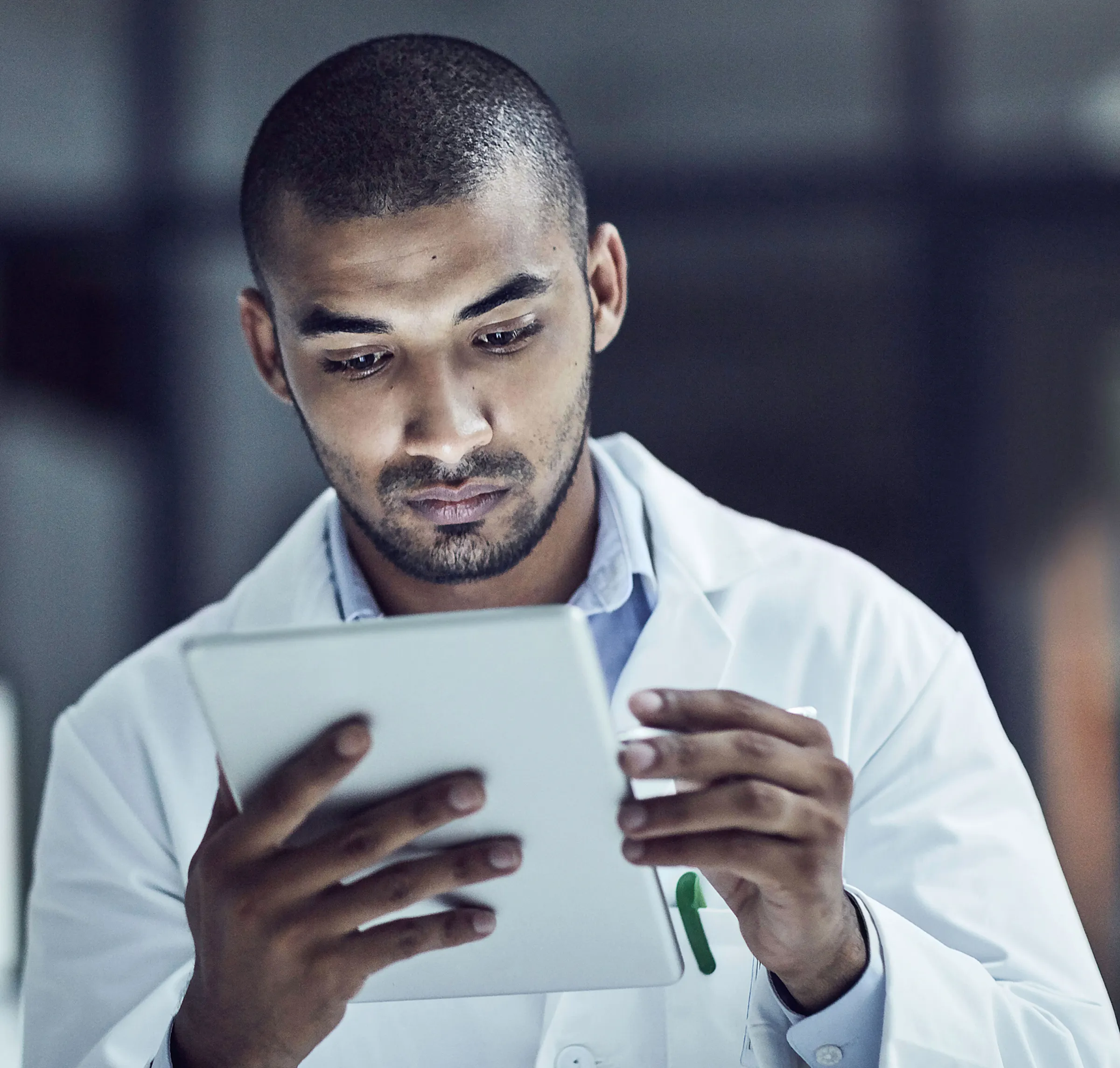 researcher looking at tablet