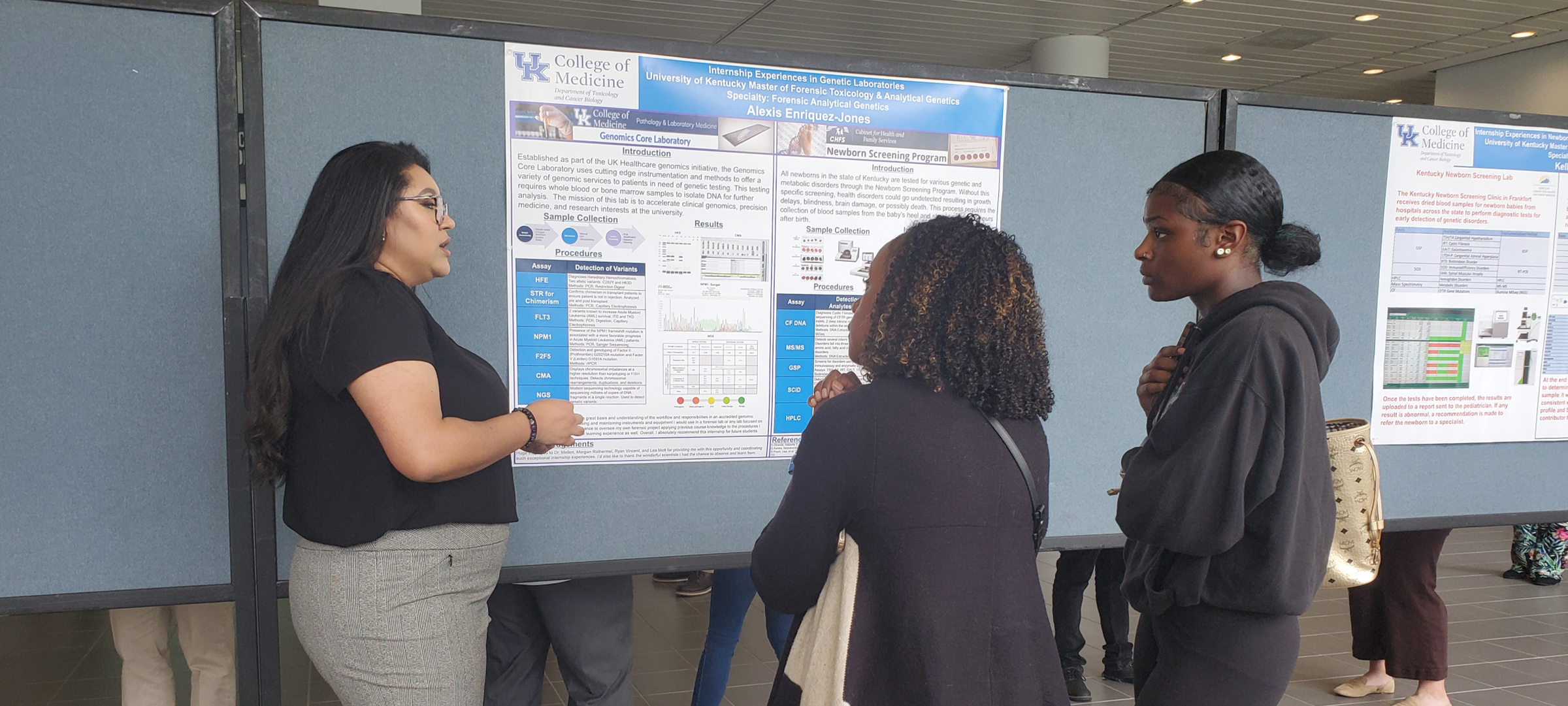 Interns presenting posters at a College of Medicine event.