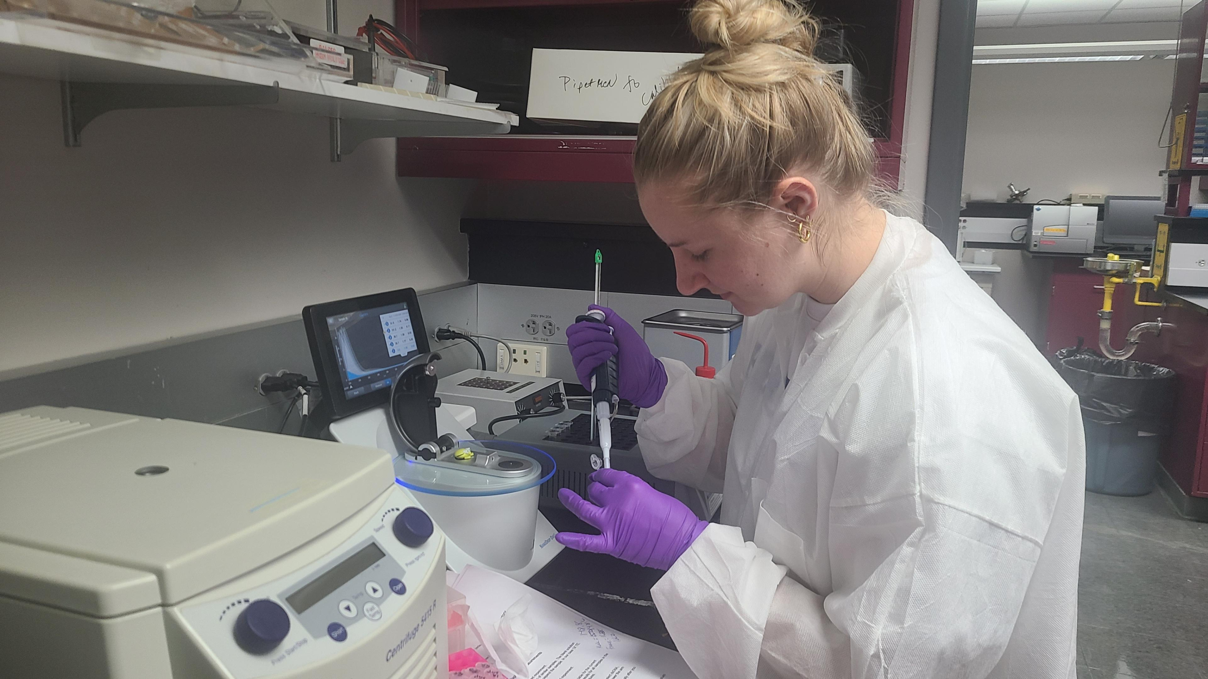 Forensic student using a NanoDrop to measure amounts of DNA.