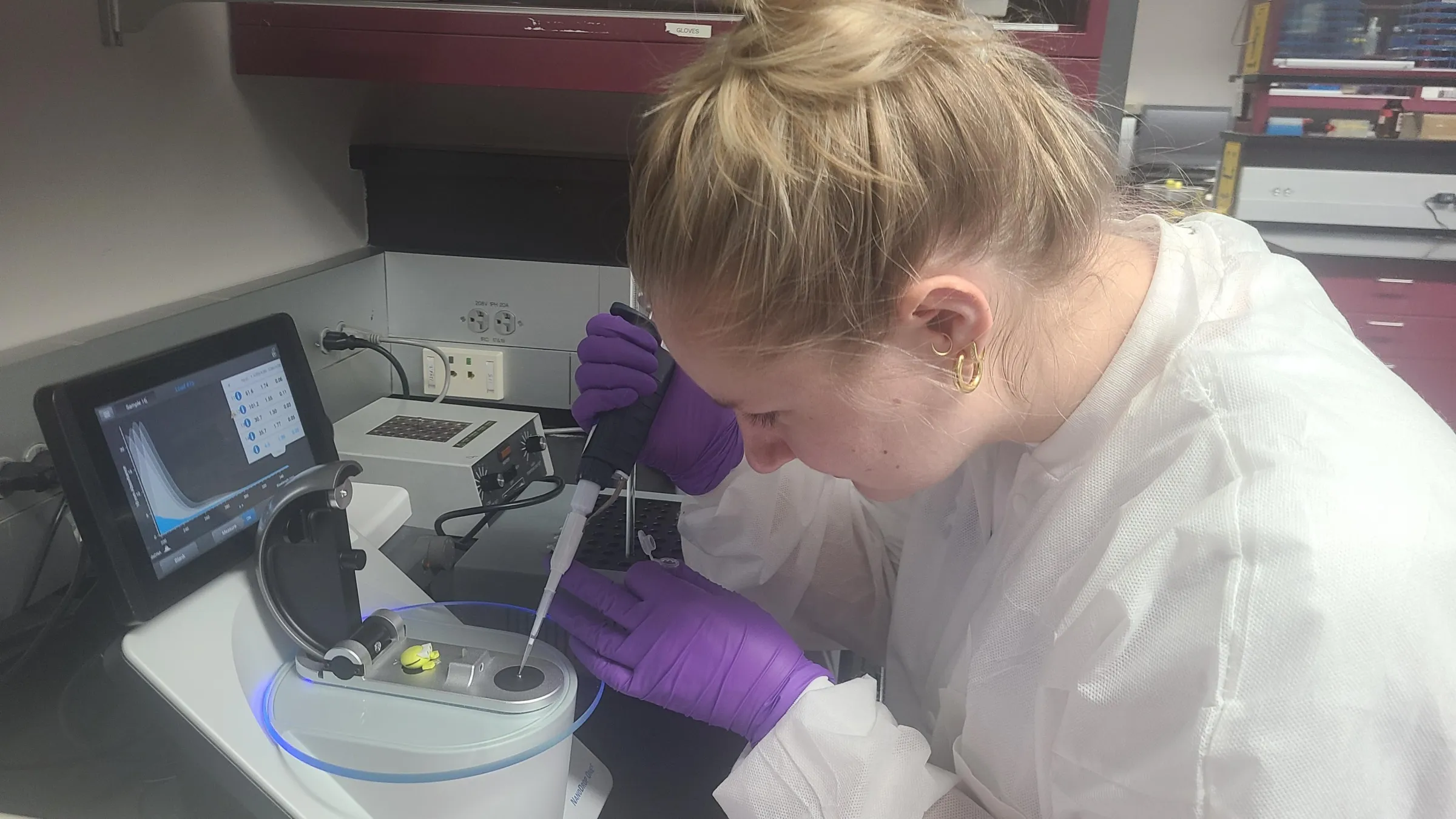 Forensic student using a NanoDrop to measure amounts of DNA.