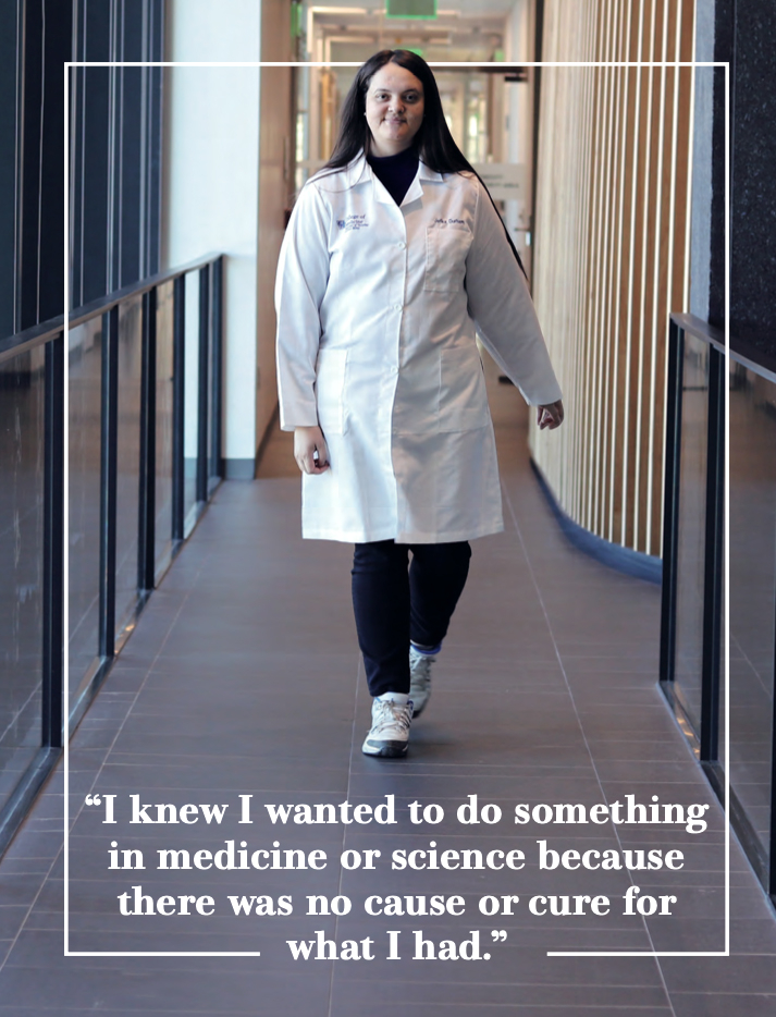 Female student in lab coat walking down a hallway. The graphic contains a quote from the student that says, "I knew I wanted to do something in medicine or science because there was no cause or cure for what I had." 