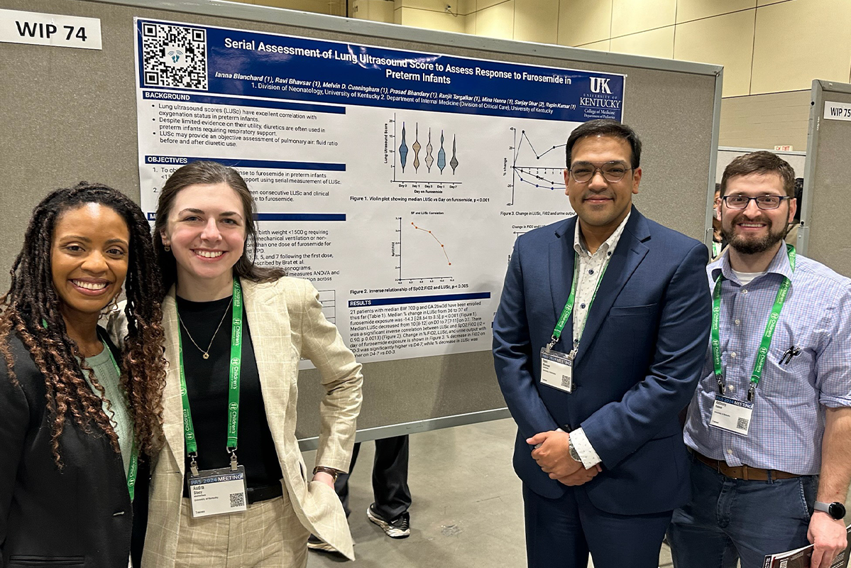 Ianna Blanchard, Audra Stacy, Ravi Bhavsar, and Anthony Haase at a poster presentation.