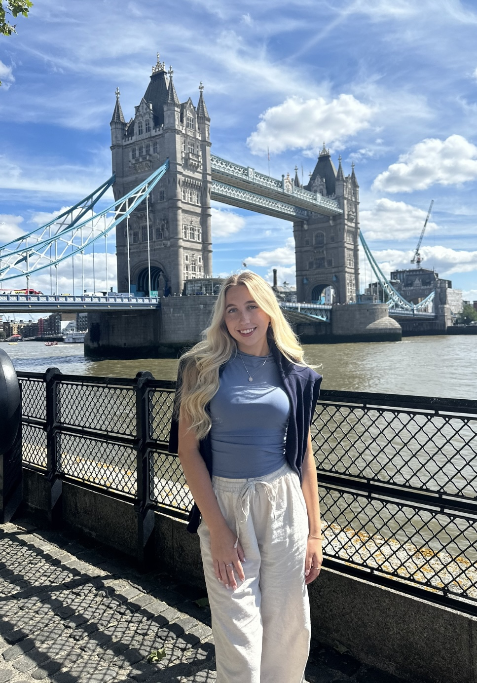 Elizabeth Hayden in front of a beautiful bridge.