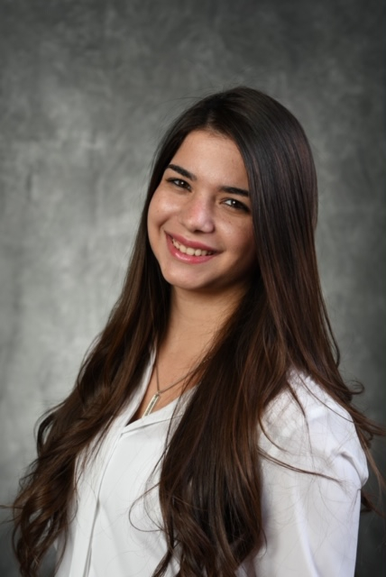 Posed headshot of Ana Cueli