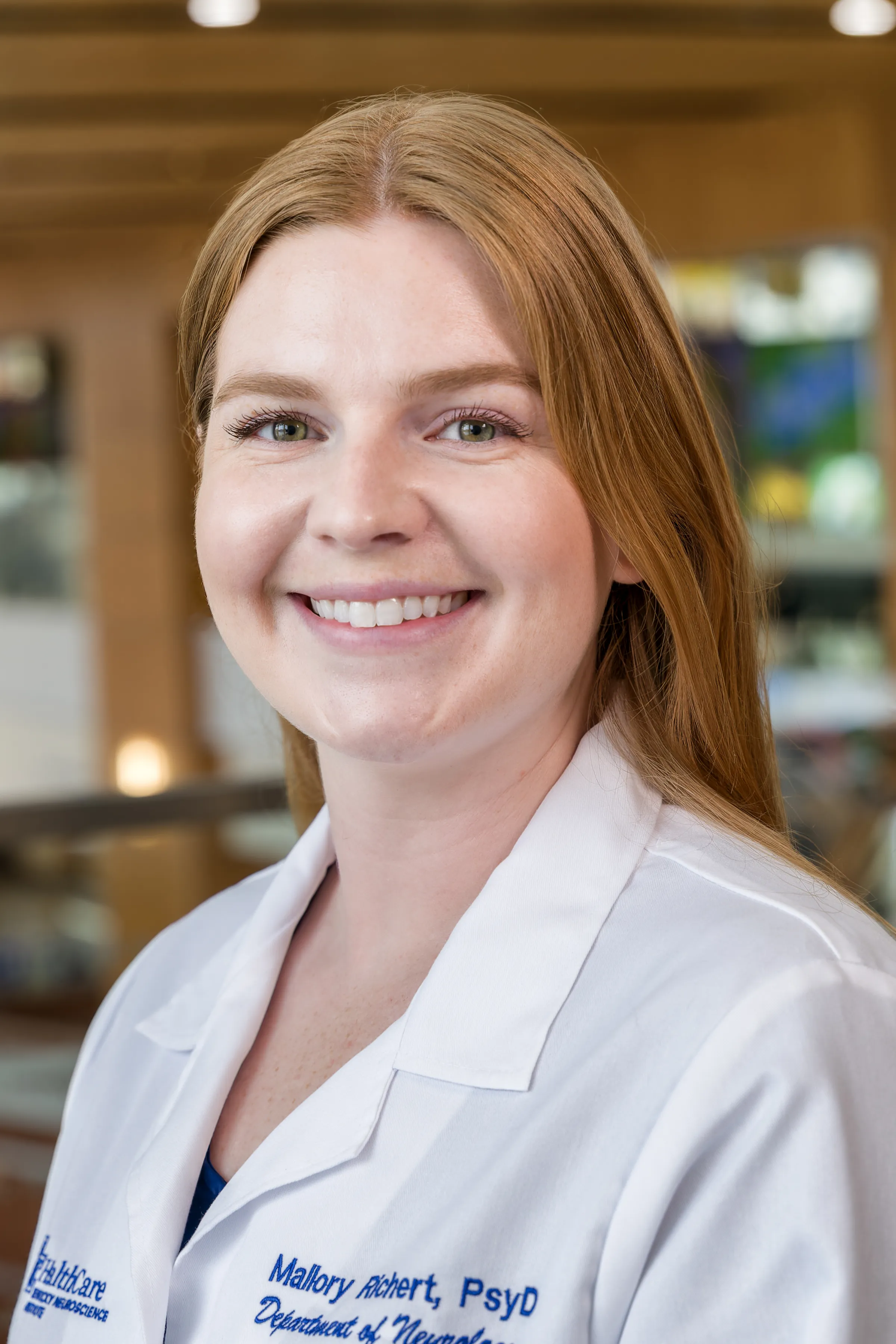 Posed headshot of Mallory Richert in labcoat